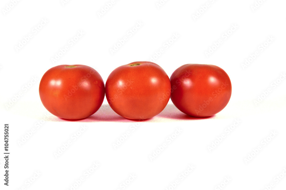 Three red tomatoes macro or close up isolated on white background Three red tomatoes macro or close up isolated on white background