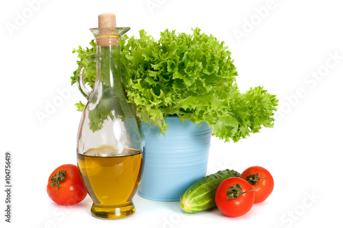 Fresh vegetables for summer salad with olive's oil, isolated on white background