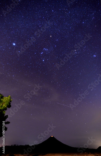 Volcano crater under stars photo