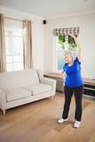 Senior woman performing stretching exercise