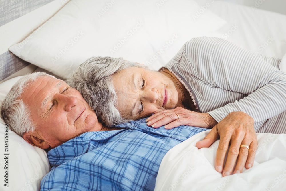 Senior couple sleeping on bed Senior couple sleeping on bed