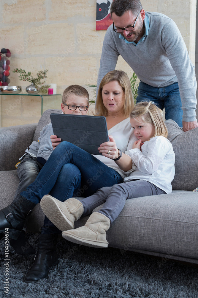 Obraz premium family at home relaxing on couch
