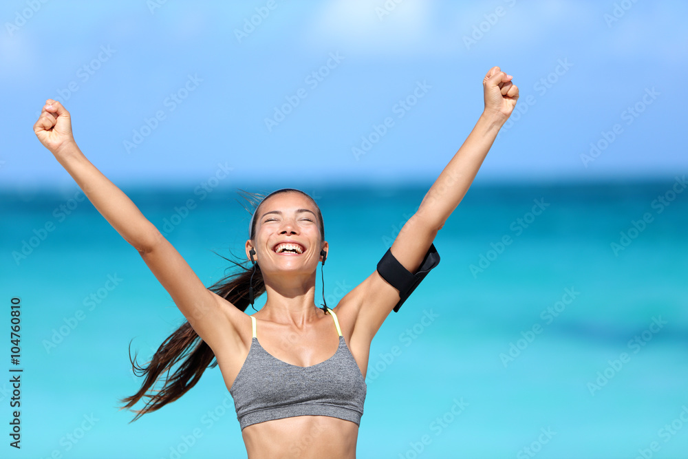 Happy success woman - achievement of fitness goals. Winning female athlete  with arms up successful of achieving her workout or diet goal. Healthy  Asian runner girl living a healthy lifestyle. Photos