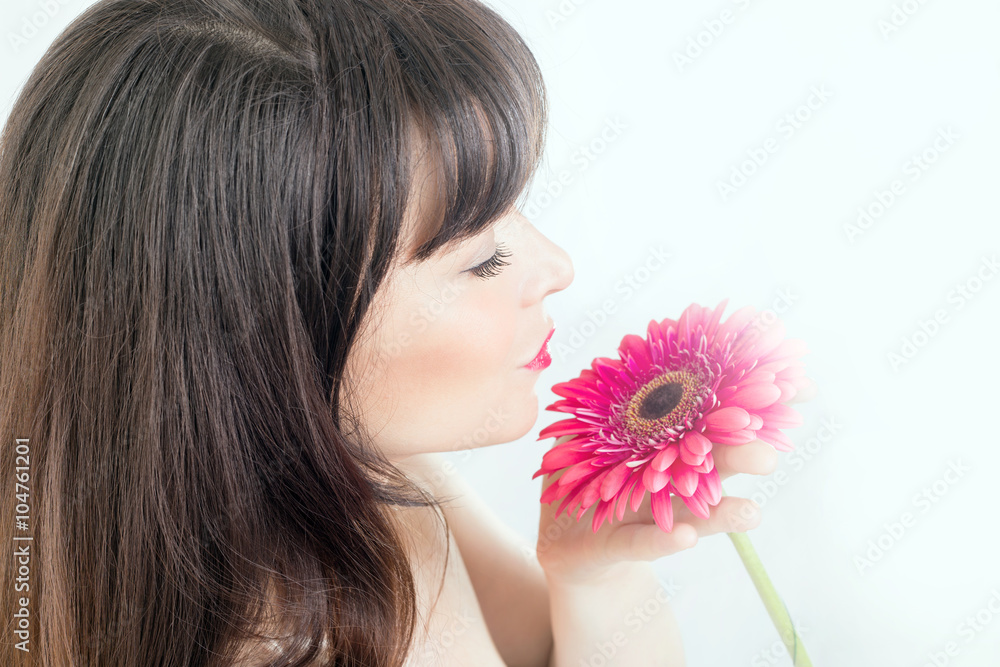 Beauty portrait of a girl with a flower 