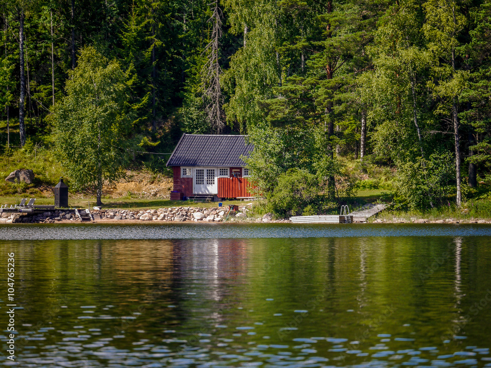 Typical hut on a lake in Sweden Typical hut on a lake in Sweden