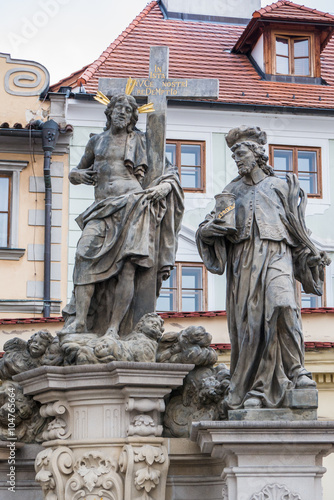 Statue of the Holy Savior with Cosmas and Damian on Charles Bridge in Prague
