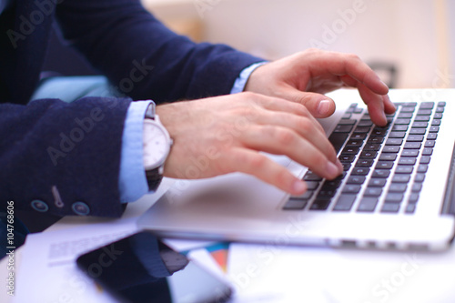 businessman working at a computer hands closeup