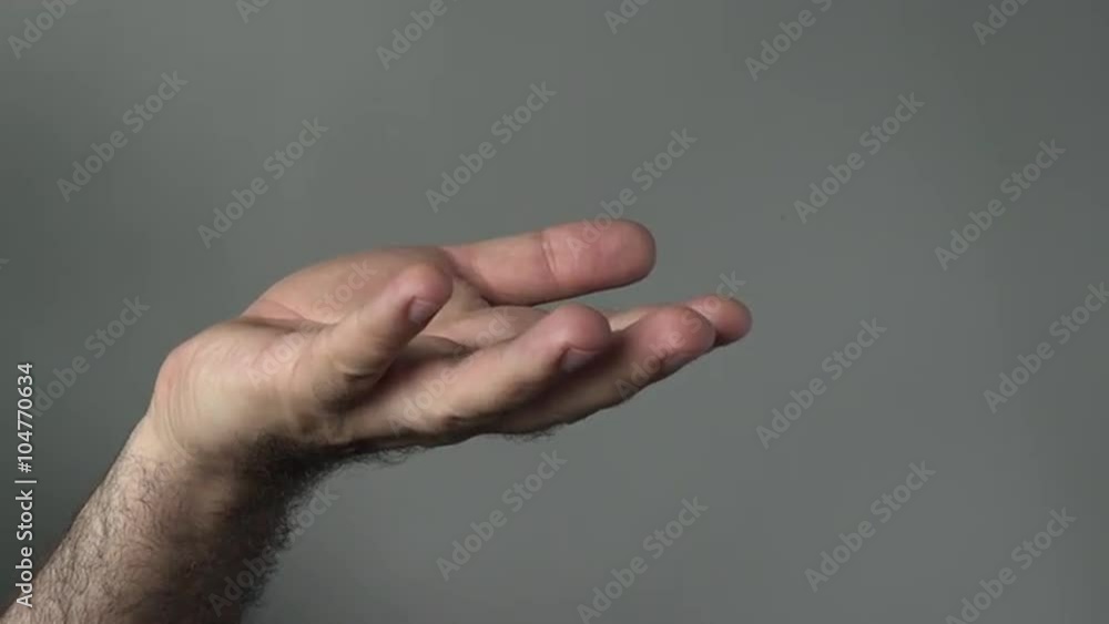 Man hand begging on a grey background. Concepts and ideas with copy space Man hand begging on a grey background. Concepts and ideas with copy space