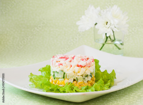 Layered salad of crab sticks and canned corn