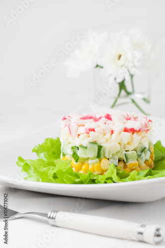 Layered crab sticks salad with corn