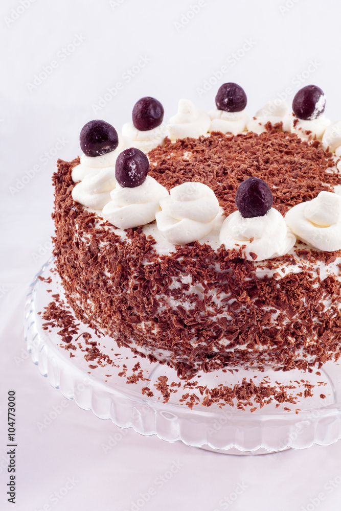 Black forest cake decorated with whipped cream and cherries. Black forest cake decorated with whipped cream and cherries.