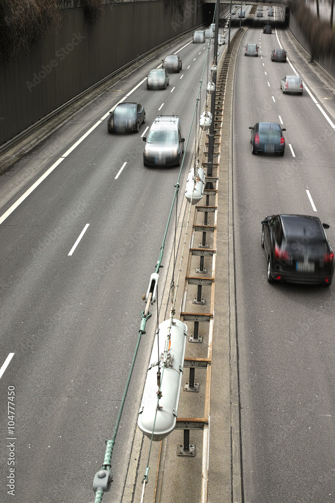 Cars on a Highway.Vehicle traffic on a busy city road in perspective.