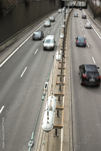 Cars on a Highway.Vehicle traffic on a busy city road in perspective.