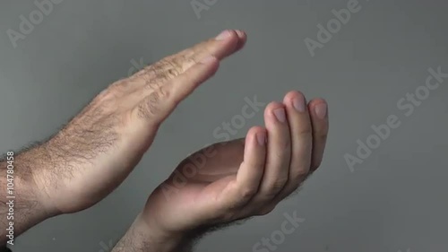 Man hands clapping on a grey background. Concepts and ideas with copy spaceThis video is about W photo