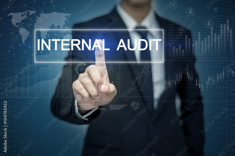 Businessman hand touching INTERNAL AUDIT button on virtual scre Businessman hand touching INTERNAL AUDIT button on virtual scre