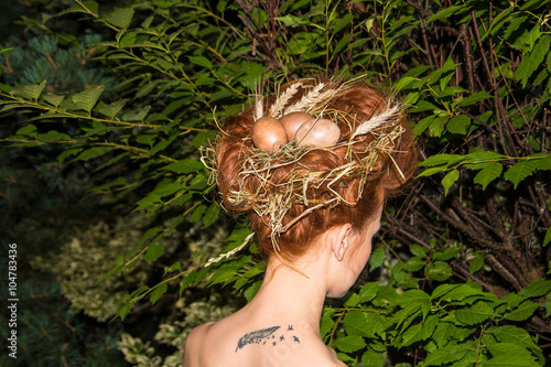 Bird's nest and egg in a woman's head