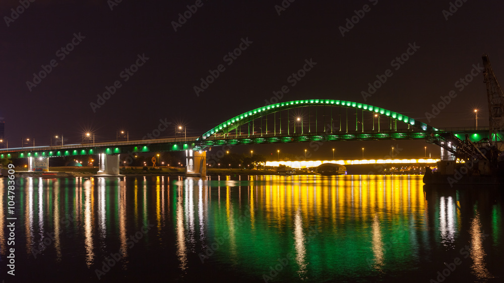 Old Tram bridge across the Sava river in Belgrade shot at night