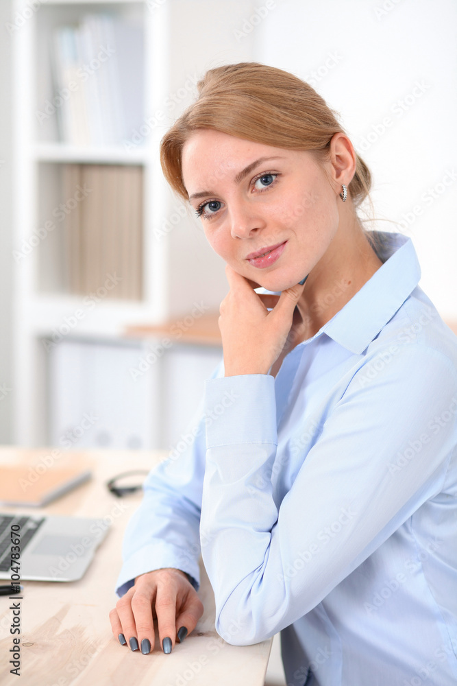 Young blonde business woman with laptop in the office. Business concept. Young blonde business woman with laptop in the office. Business concept.