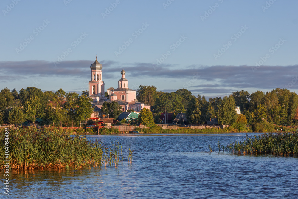 Valdai. View of the city and the Cathedral of the Holy Trinity from the Valdai lake on a summer morning