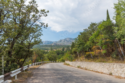 Summer landscape in the mountains with the road. Crimea mountain views array Ai-Petri from the old top South Coast Highway in Alupka on a summer day