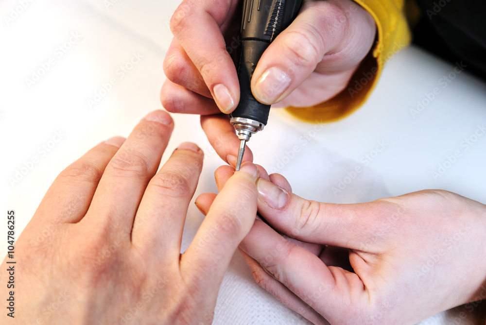 Hardware manicure in a beauty salon.