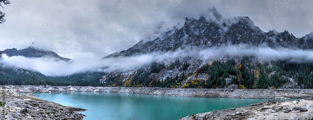 Alpine Turquoise Lake with Mounatins and Clouds. Snow Lake, one of Enchantment lakes, WA, USA. 
