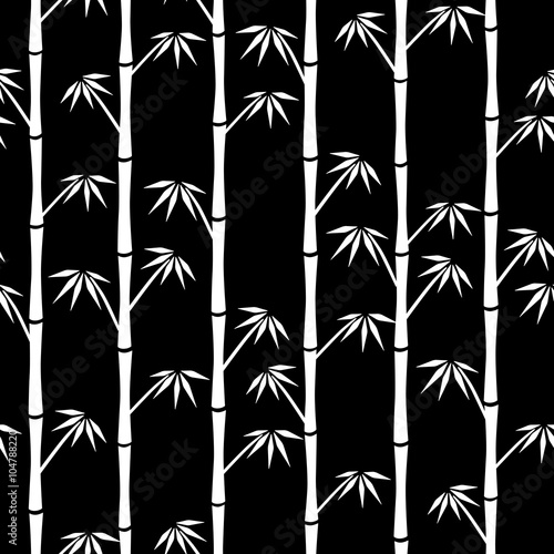 White silhouettes of bamboo on black background