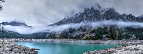 Alpine Turquoise Lake with Mounatins and Clouds. Snow Lake  one of Enchantment lakes  WA  USA. 