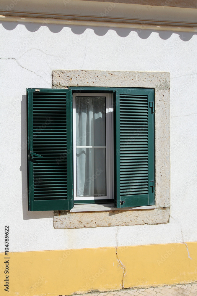 portuguese window with green shutter