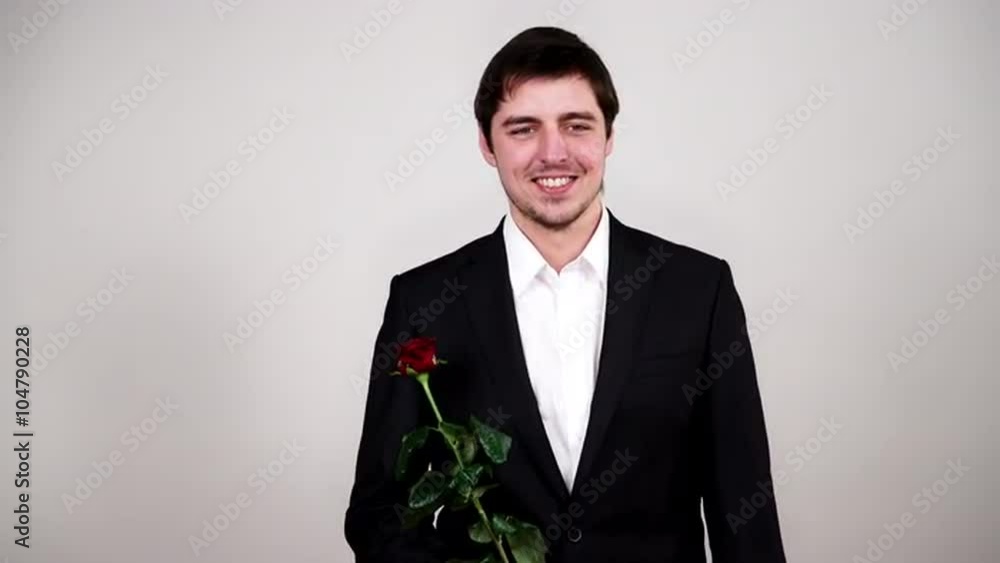 Man wearing suit holds red rose flower 4K Man wearing suit holds red rose flower 4K