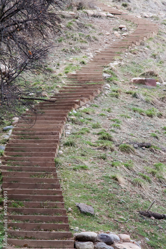 Curving wooden stairs on Centennial trail in CO - vertical Curving wooden stairs on Centennial trail in CO - vertical
