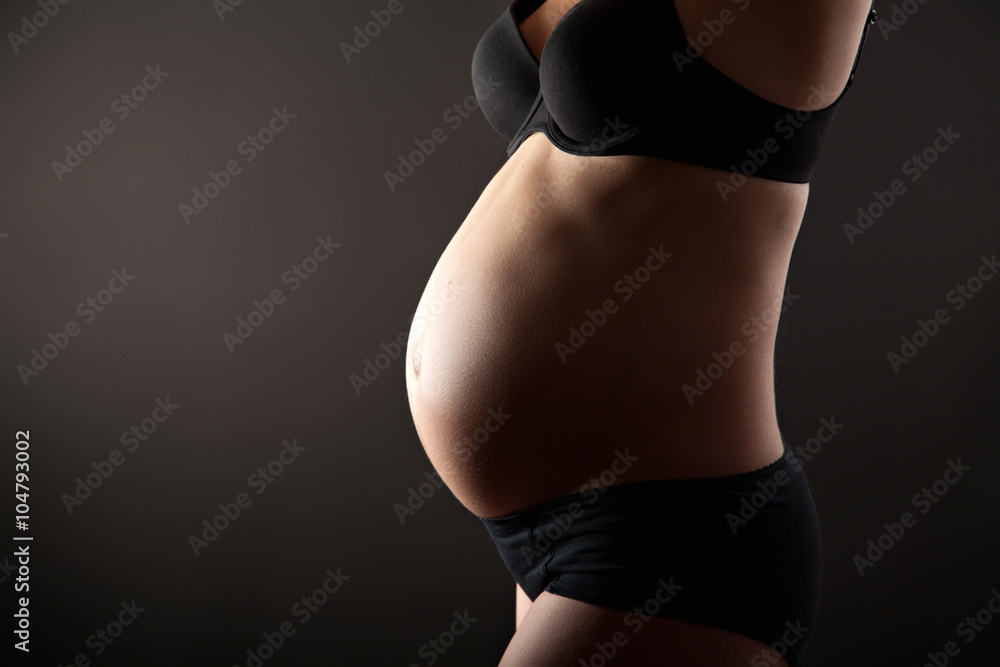 Fototapeta premium Belly of pregnant woman