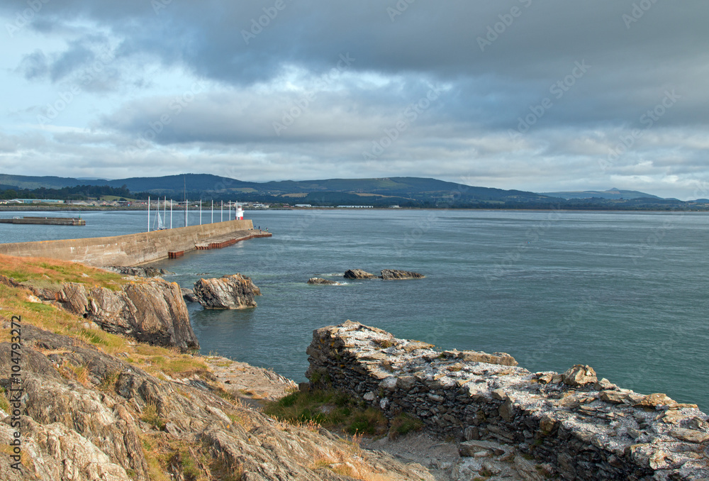 Wicklow Ireland North Harbor Pier Breakwater Jetty Wall and Lighthouse with sailboat