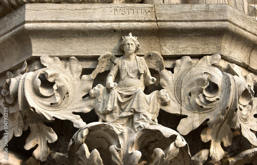 Justice goddess on Doge's Palace beautiful capital, in Venice photo