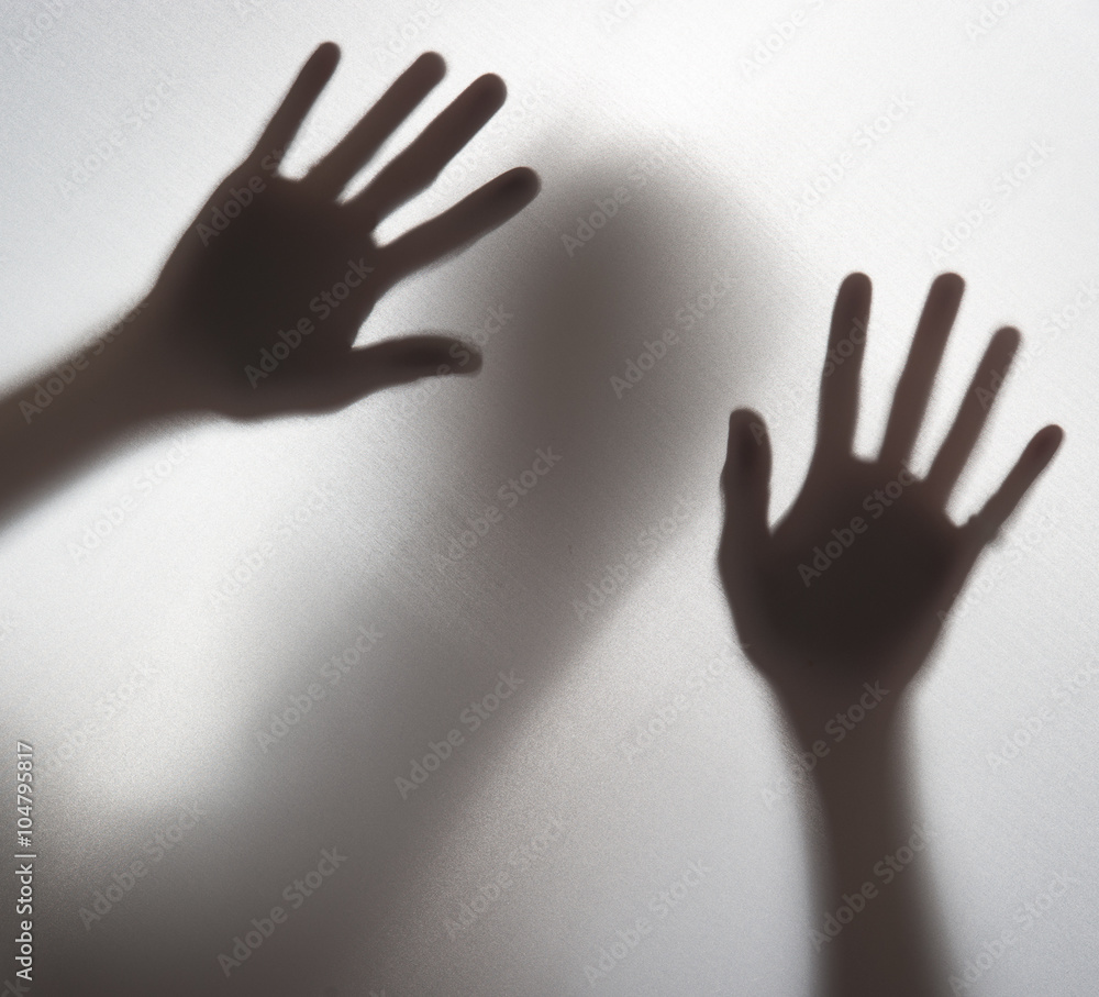 Silhouette of a hand in the back light,blur image