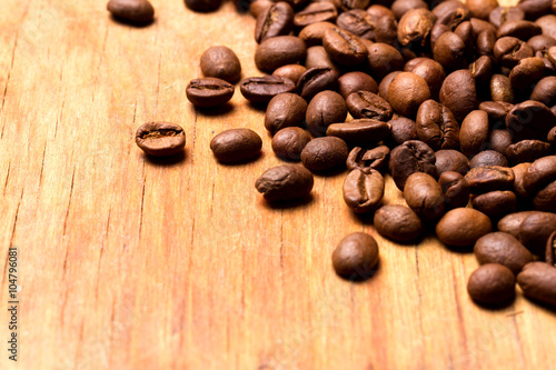 Fototapeta Naklejka Na Ścianę i Meble -  Coffee beans on wood background