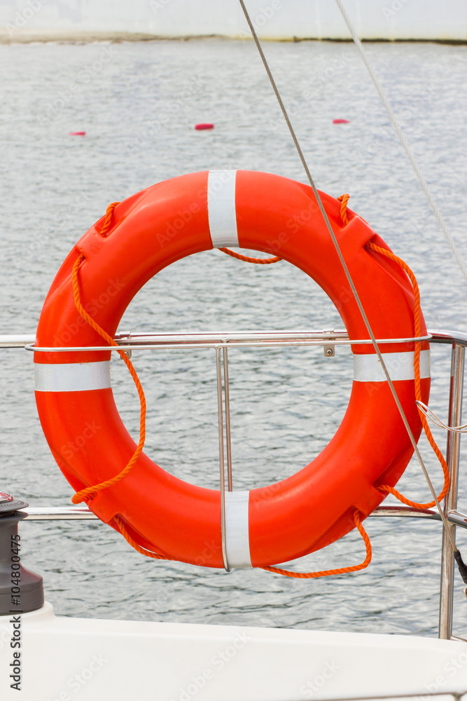 Yachting, orange lifebuoy on sailboat, safety travel