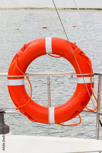 Yachting, orange lifebuoy on sailboat, safety travel