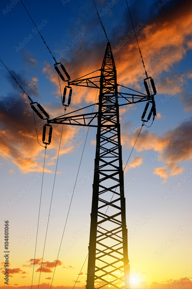 High voltage towers against the sunset