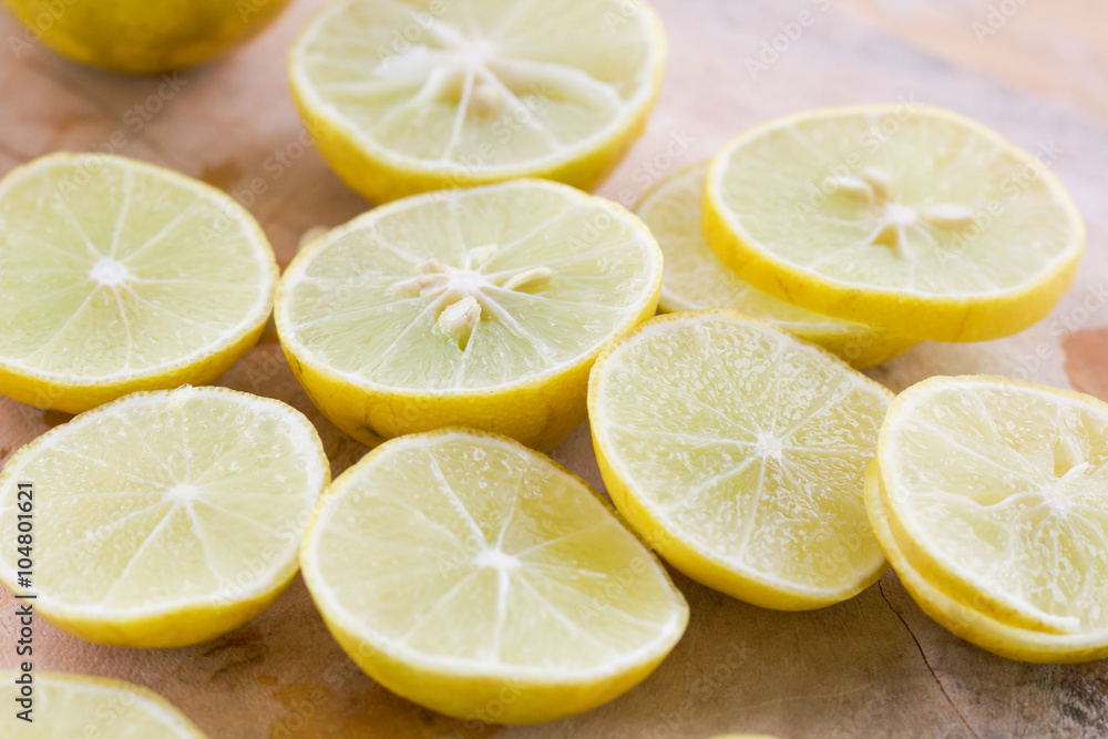 lemon and lime on wood cutting board lemon and lime on wood cutting board
