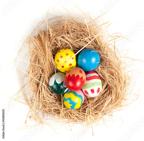 Easter eggs and hay on wooden background,morning light