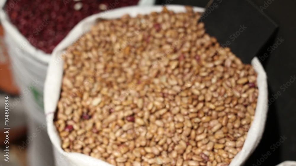 Buying beans in the market Buying beans in the market