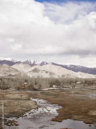 Mountain range with snow and small village