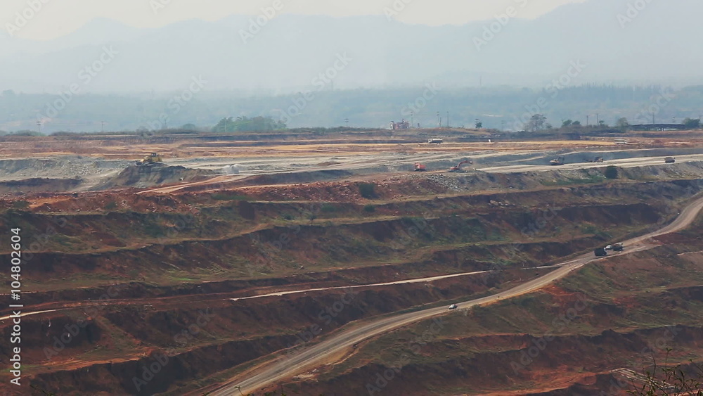 Mining dump trucks working in Lignite coalmine lampang thailand Mining dump trucks working in Lignite coalmine lampang thailand