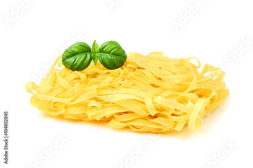  Dry homemade noodles with a sprig of Basil.