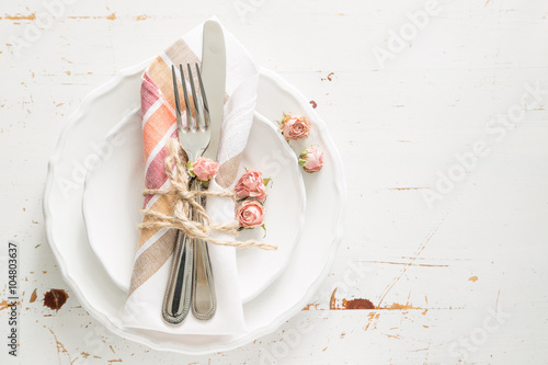 Romantic table setting with died flowers