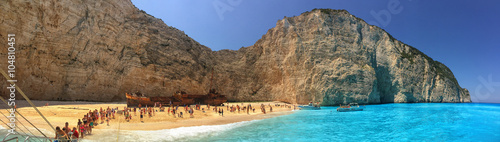 Tourists in Navagio Bay with Wrecked Ship