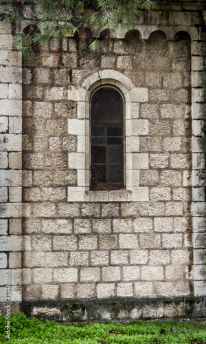 Arched window in the stone wall  Jerusalem