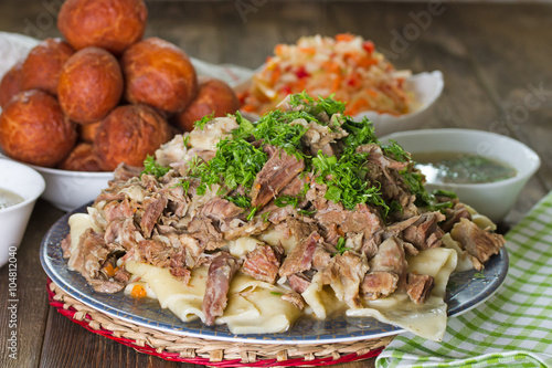 National Kazakh dishes: Beshbarmak, salad of radish Shalgam, and Baursak.