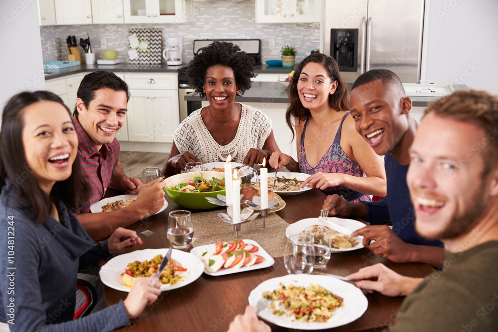 Portrait Of Friends Enjoying Dinner Party At Home Portrait Of Friends Enjoying Dinner Party At Home